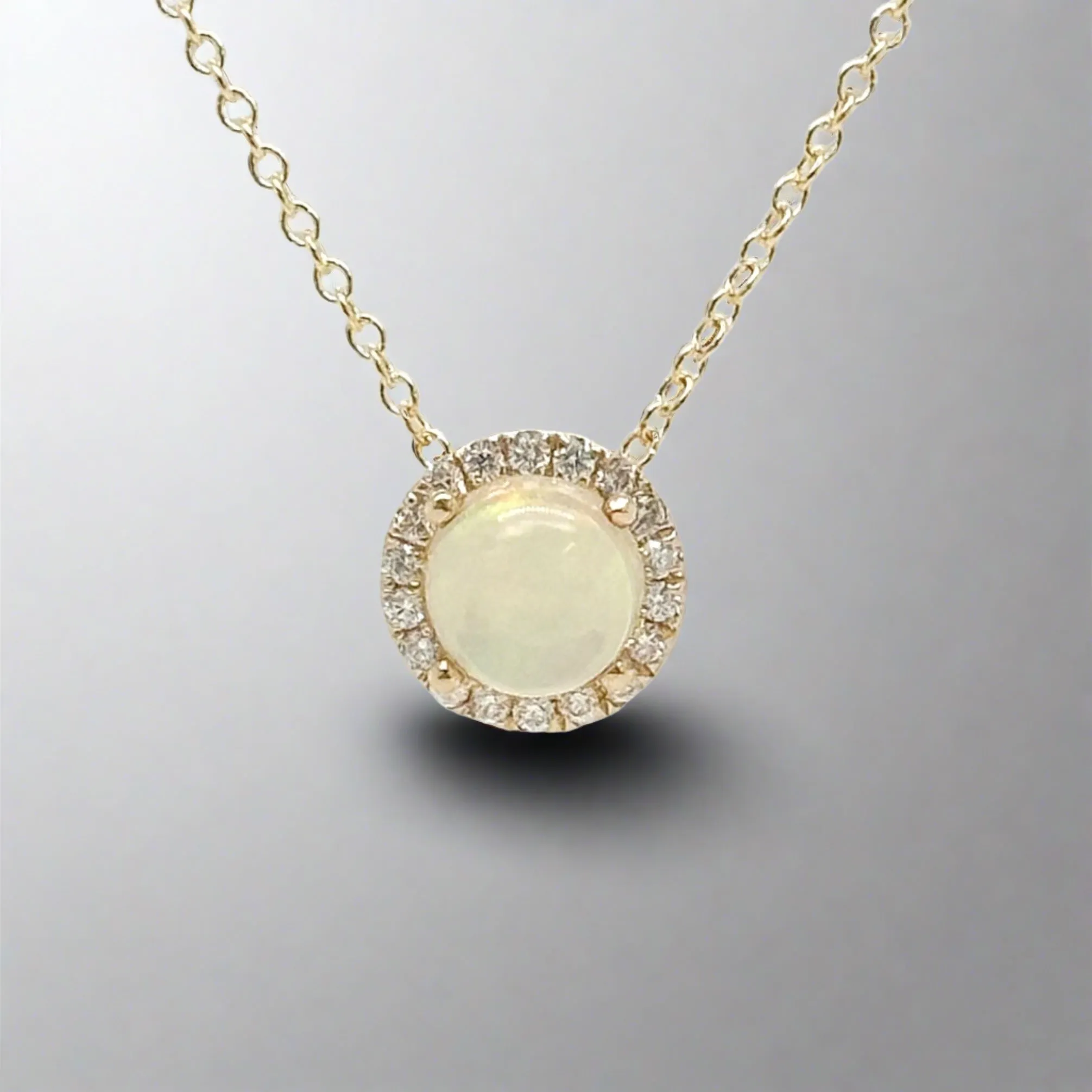 14K Y Gold 0.10ctw Diamonds 0.60ctw Round Opal Pendant