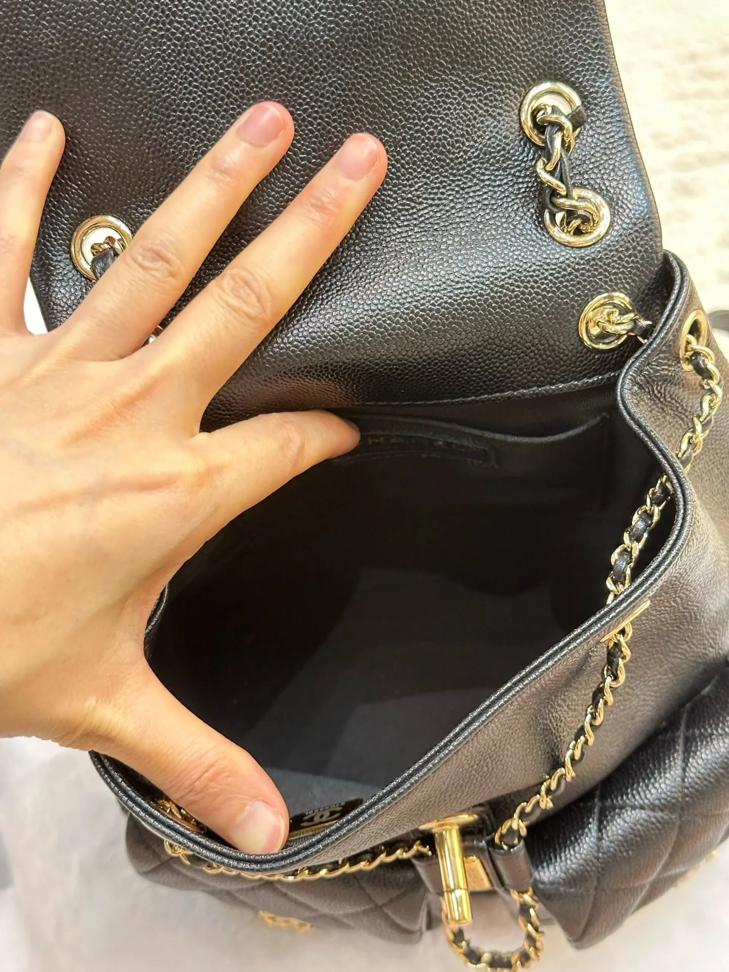 Chanel 23P Small Shiny Caviar Quilted Duma Pockets Drawstring Backpack Black GHW